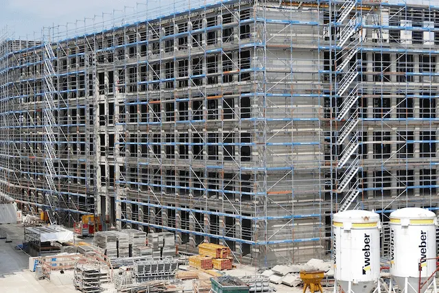 Large construction building supported by professional scaffolding from Pasadena Scaffolding Rental.